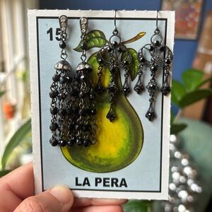 Three pairs of earrings with black accents